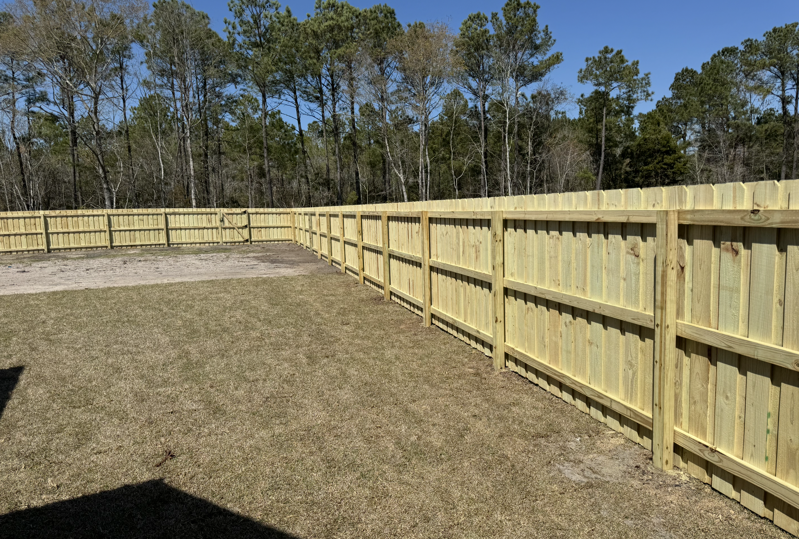 Large wood board-on-board privacy fence installation in Wilmington